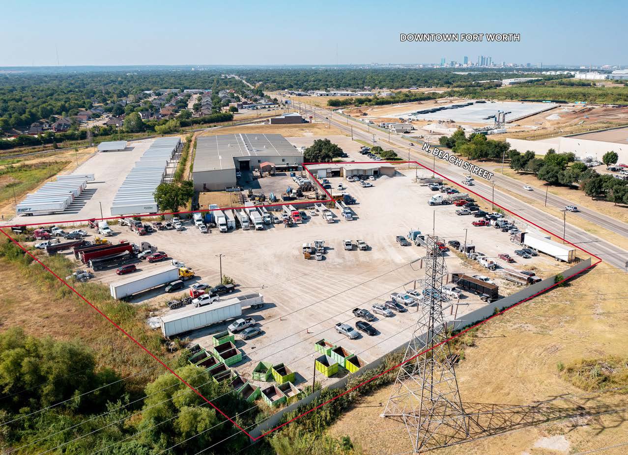 Aerial of an industrial outdoor storage yard with containers and equipment