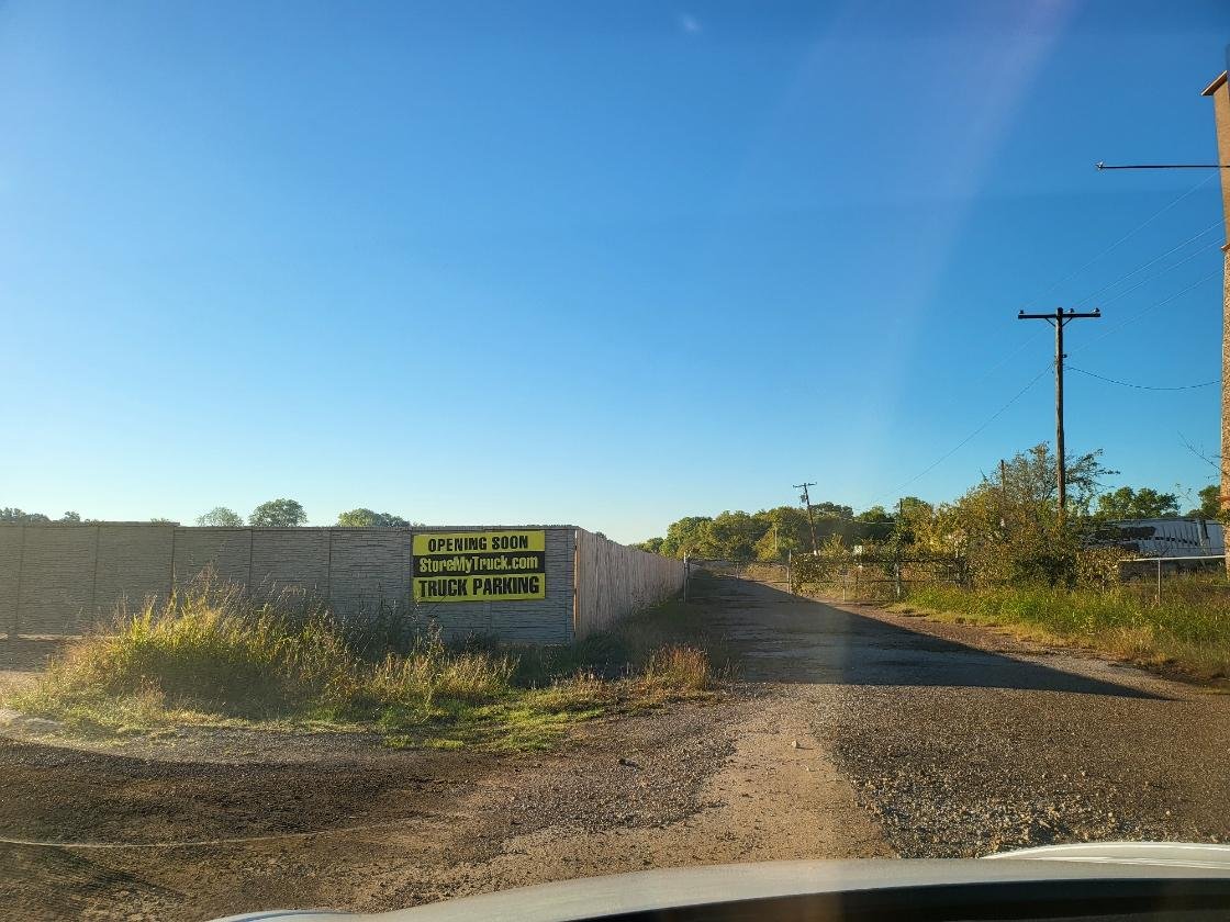 Secured, fenced outdoor truck and trailer storage lot